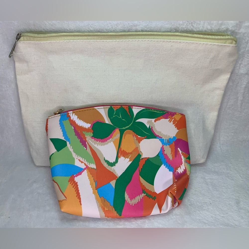 Two makeup bags with zippers, one white and one multicoloured